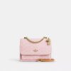 Klare-crossbody-veske i Signature Canvas med anheng