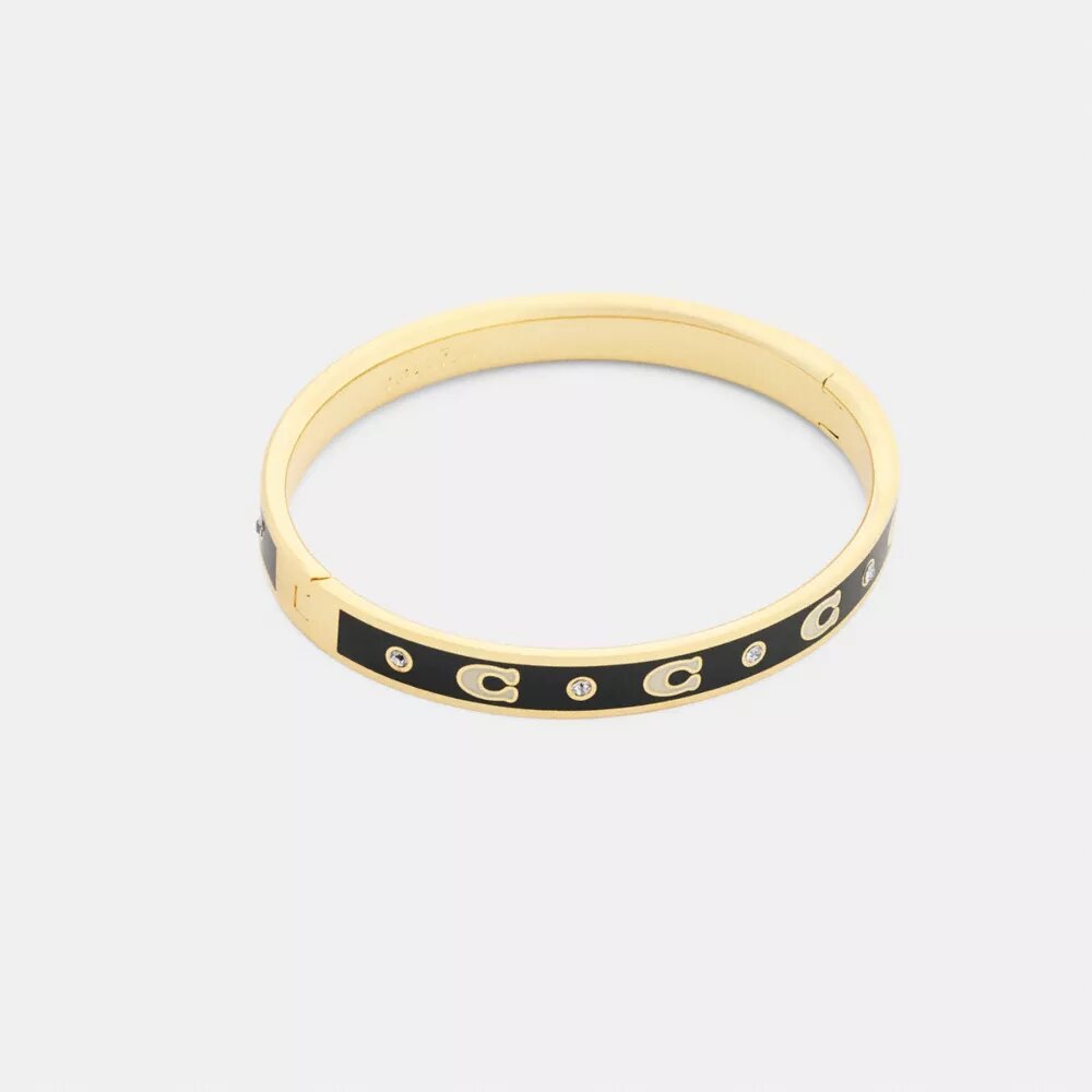 Armbånd med gjentatte C-er og hengsler