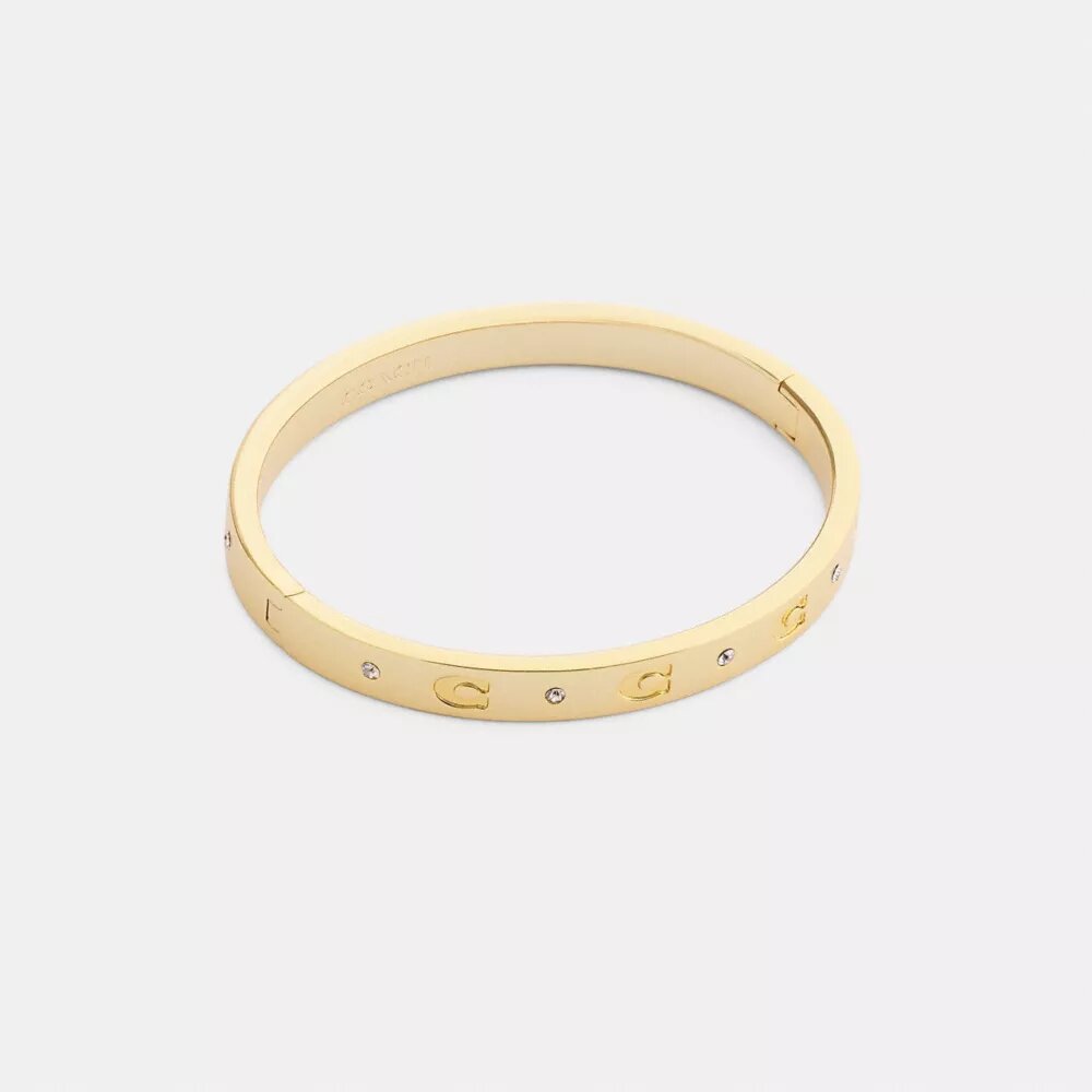 Armbånd med gjentatte C-er og hengsler