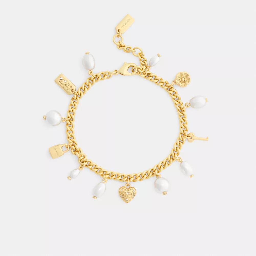 Armbånd med perle- og hjerteanheng