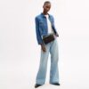 Audrey-crossbody-veske i Signature Canvas