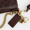 Audrey-crossbody-veske i Signature Canvas