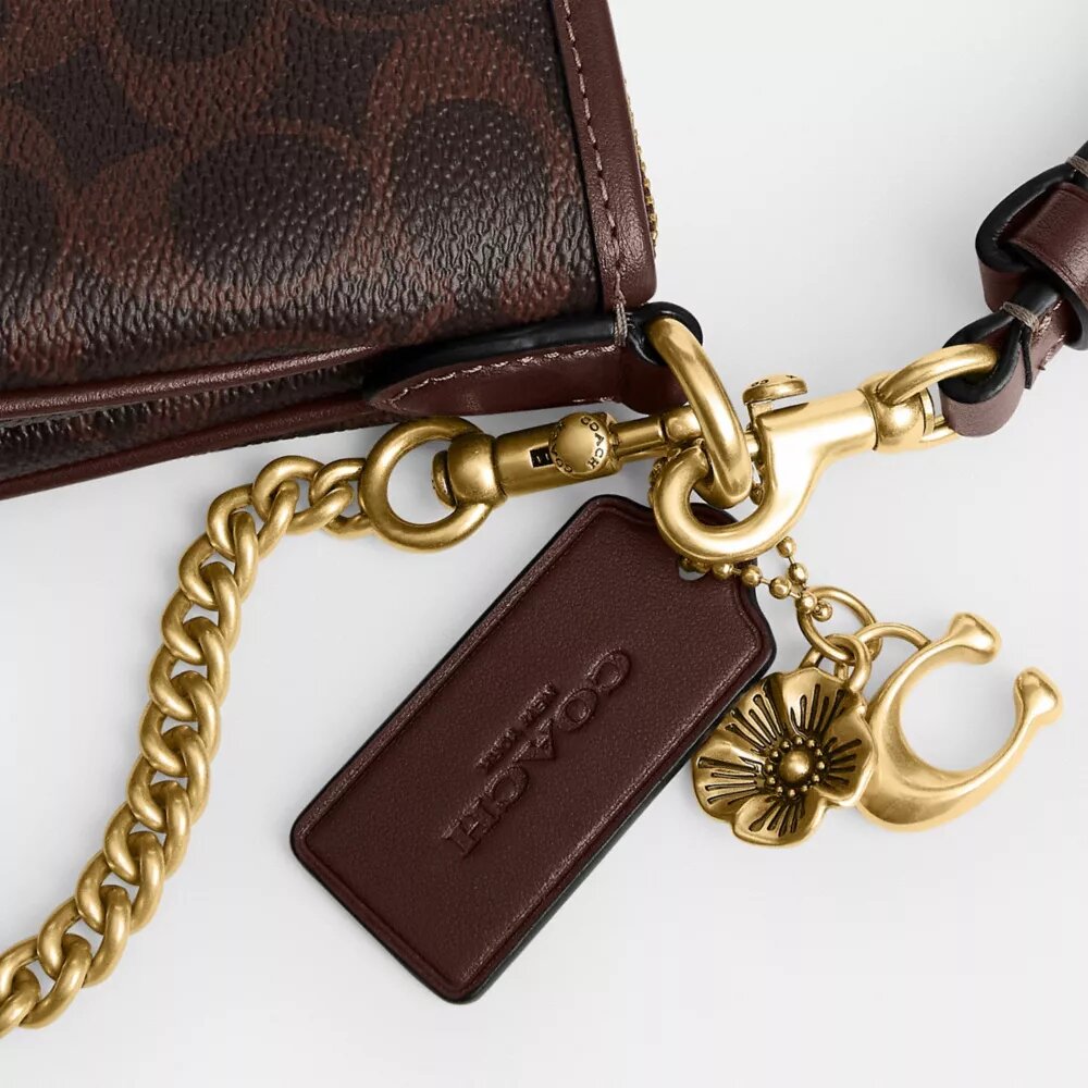 Audrey-crossbody-veske i Signature Canvas