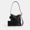 Bleecker-bucketveske i shearling