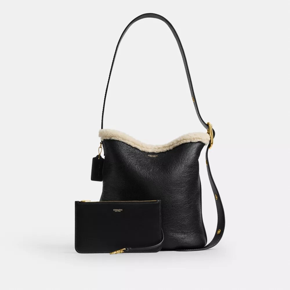Bleecker-bucketveske i shearling