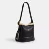 Bleecker-bucketveske i shearling
