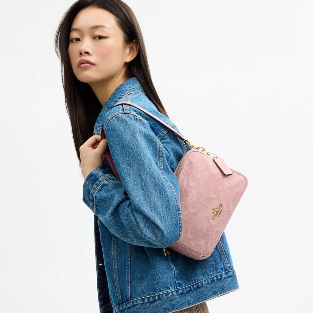 Carey-crossbody-veske i signaturdenim
