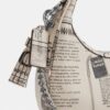 Carmen Mini-crossbody-veske med avisprint