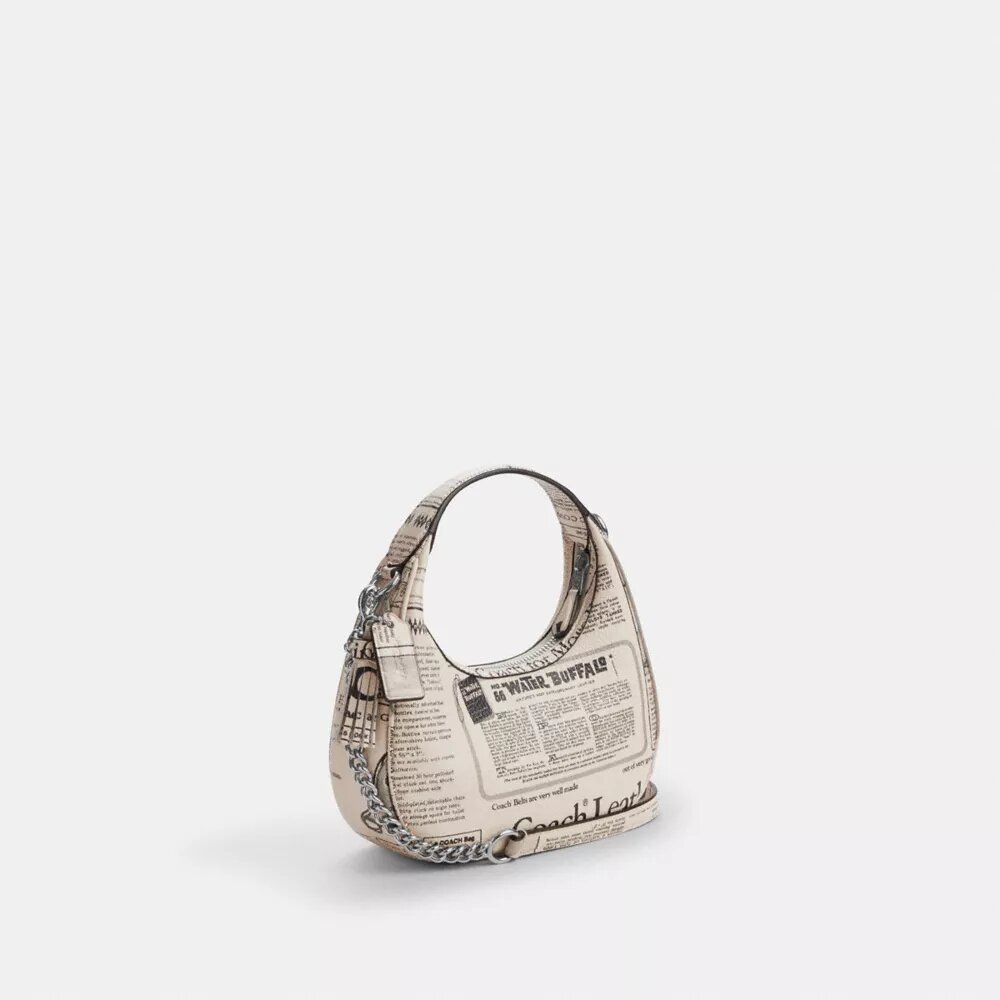 Carmen Mini-crossbody-veske med avisprint