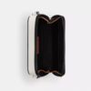 Charter Slim-crossbody-veske i Signature Canvas