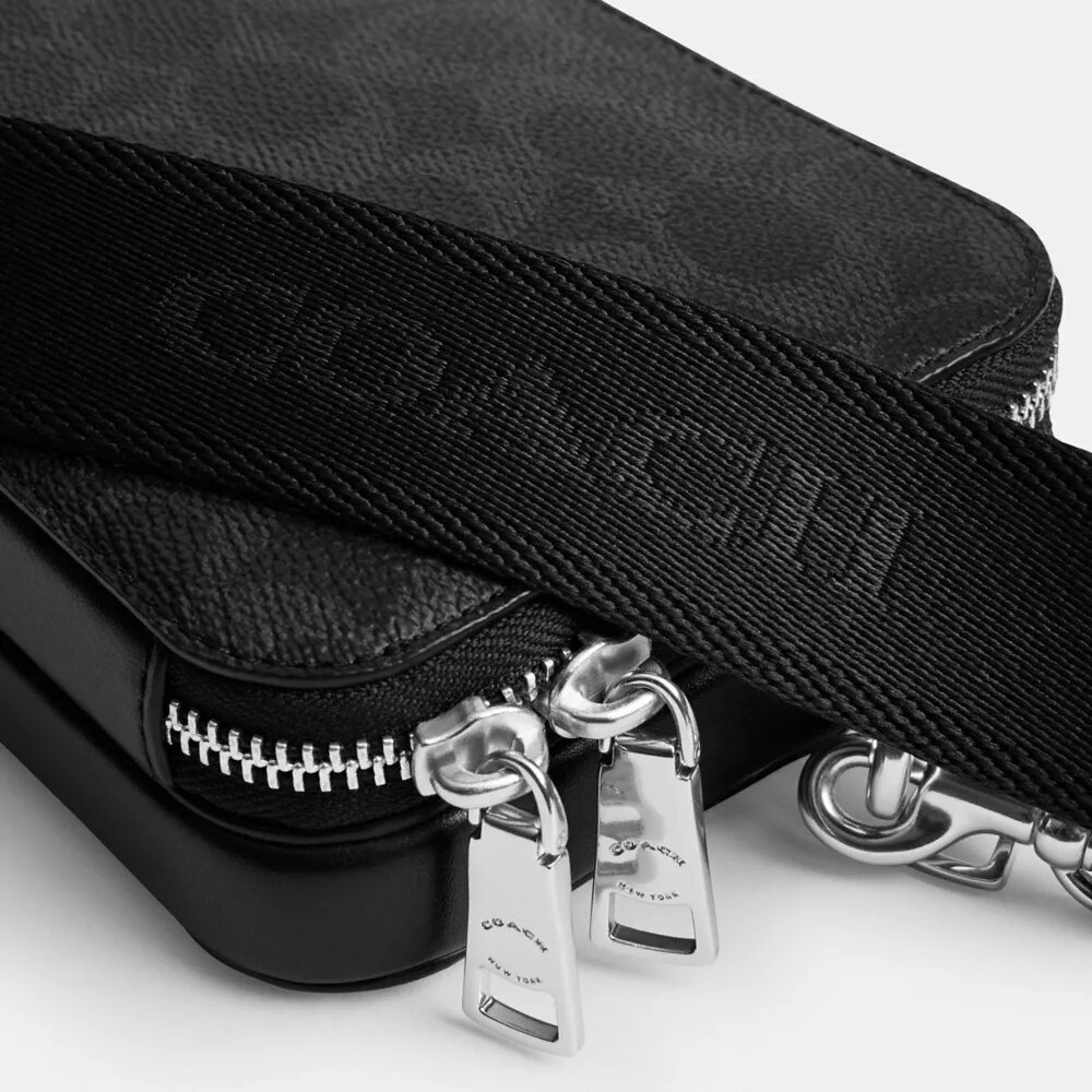 Clinton-crossbody-veske i Signature Canvas