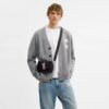Clinton-crossbody-veske med grafisk motiv