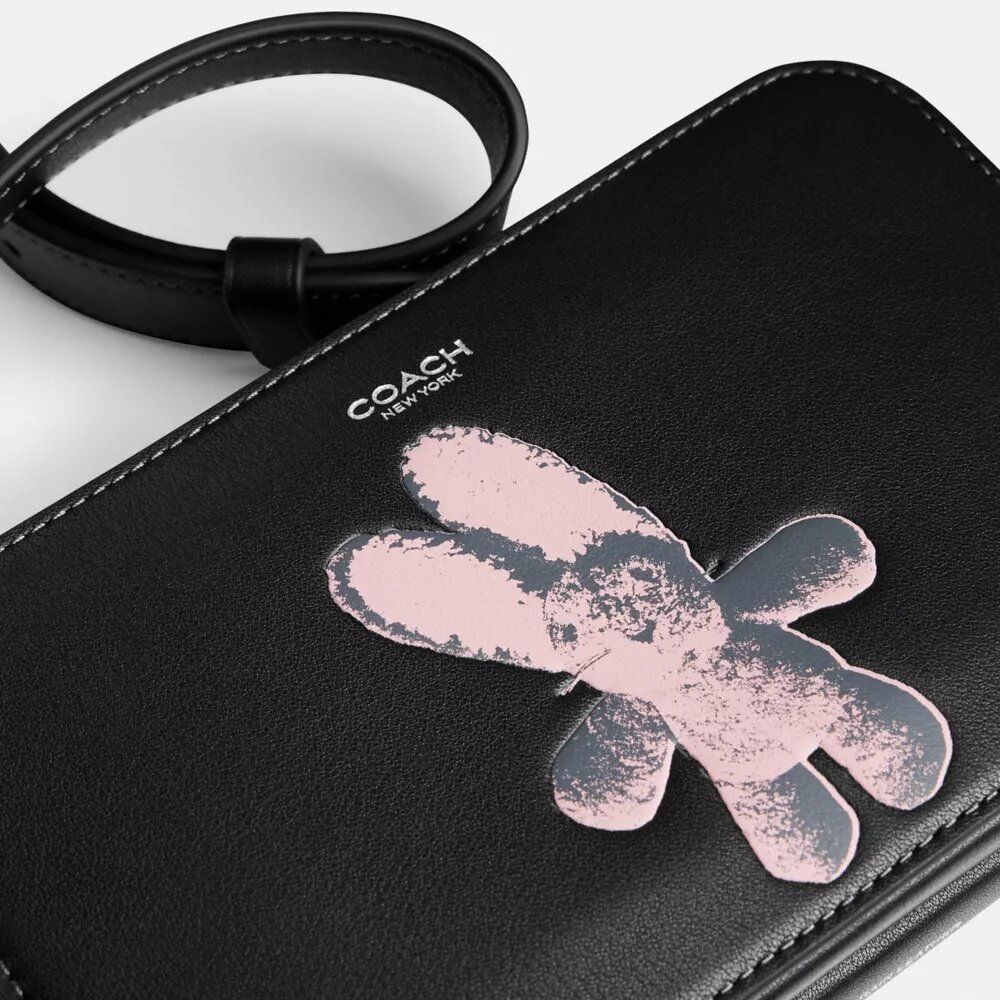 Clinton-crossbody-veske med grafisk motiv