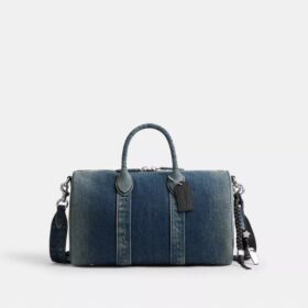 Compass Bag 35 i regenerativ bomullsdenim med anheng