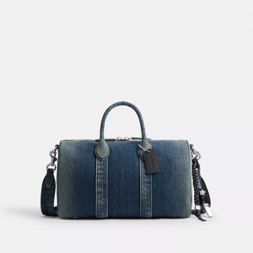 Compass Bag 35 i regenerativ bomullsdenim med anheng