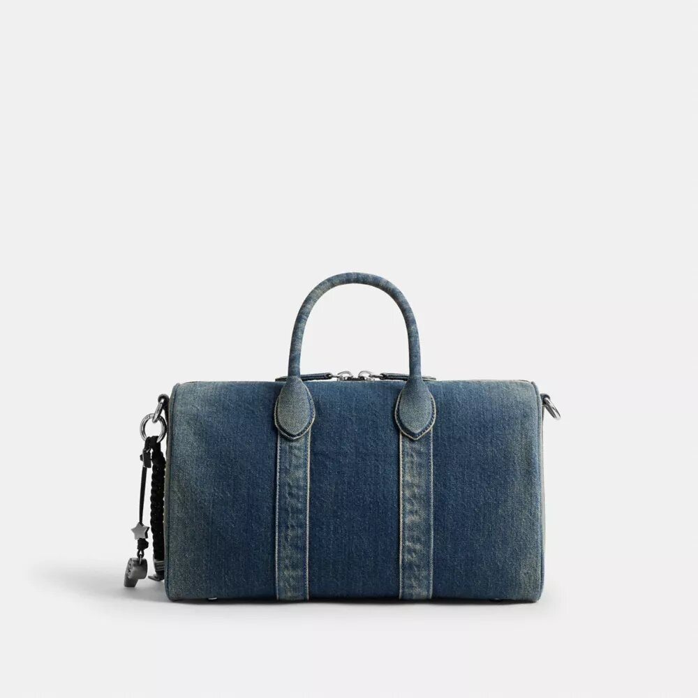 Compass Bag 35 i regenerativ bomullsdenim med anheng