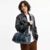 Compass Bag 35 i regenerativ bomullsdenim med anheng