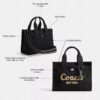 Disney X Coach Cargo Tote-vesker 26 med Mikke Mus i regenerativt bomullslerret