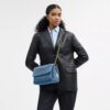 Elodie-crossbody-veske i regenerativ bomull med vattering