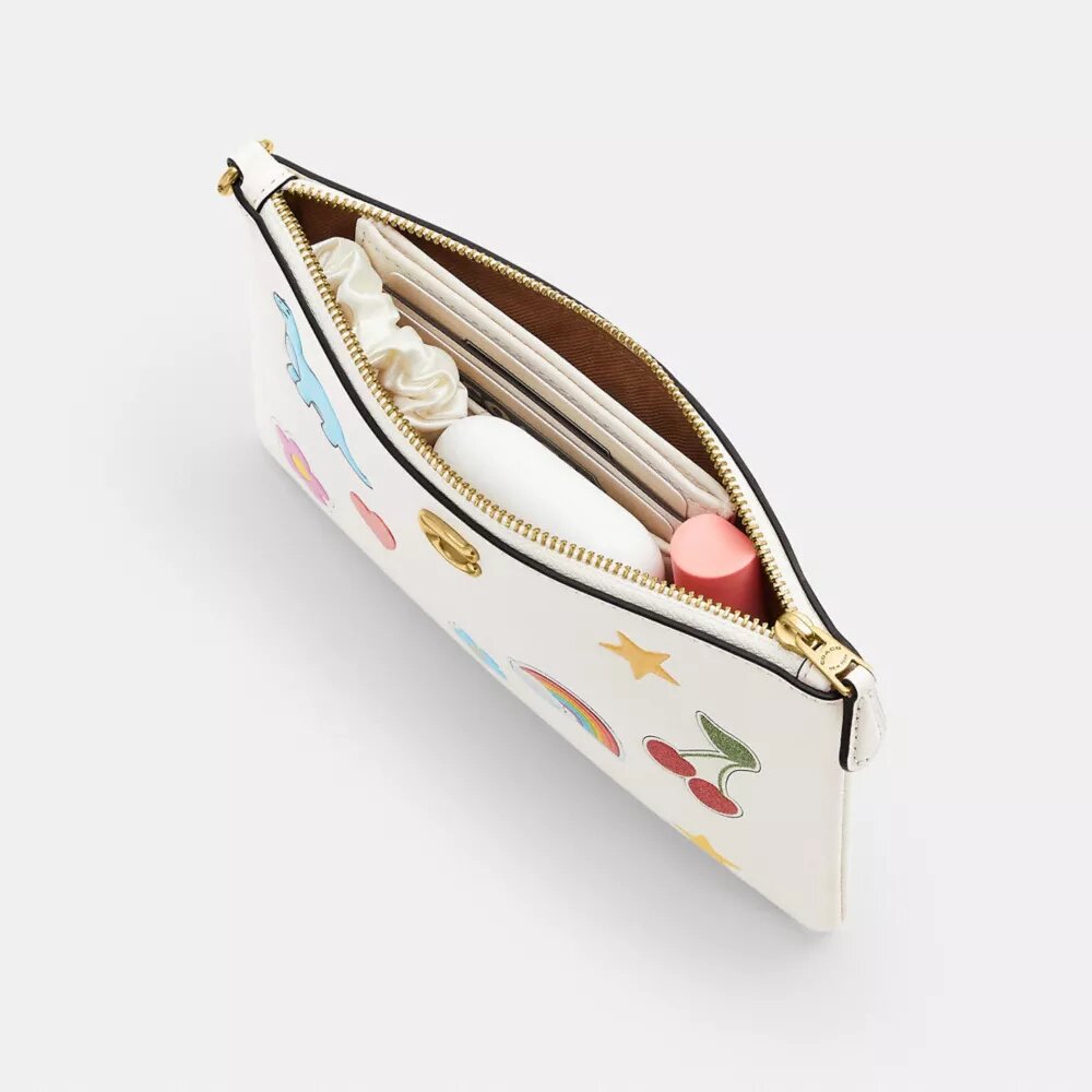 Essential liten håndleddsveske med klistremerke-trykk