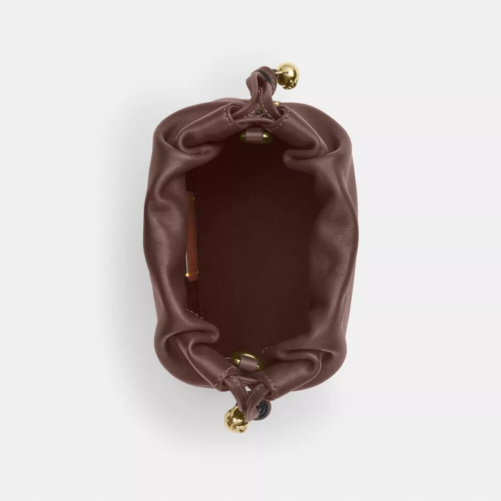 Faye Mini-snøreveske