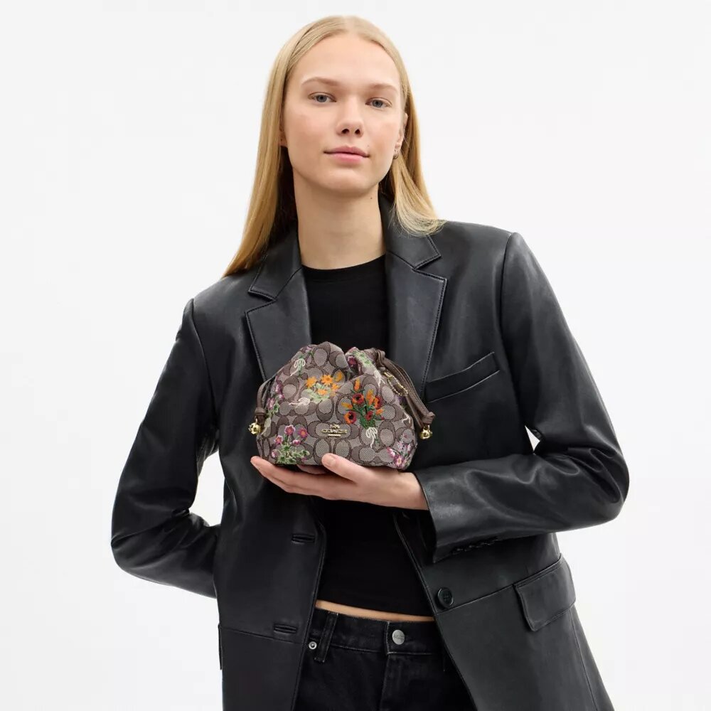 Faye Miniveske i signaturjacquard med blomsterbroderi