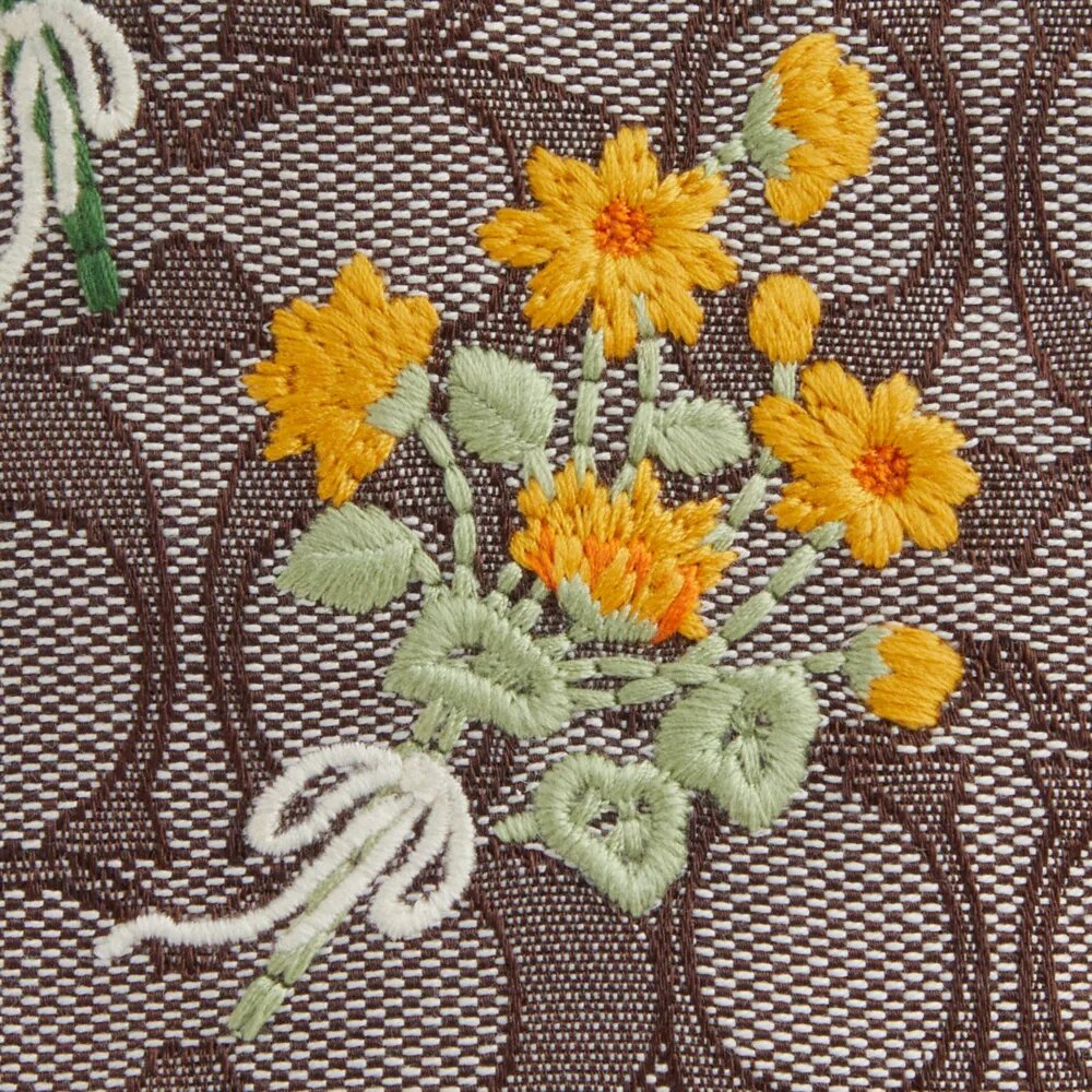 Faye Miniveske i signaturjacquard med blomsterbroderi