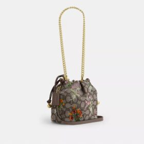 Faye Miniveske i signaturjacquard med blomsterbroderi
