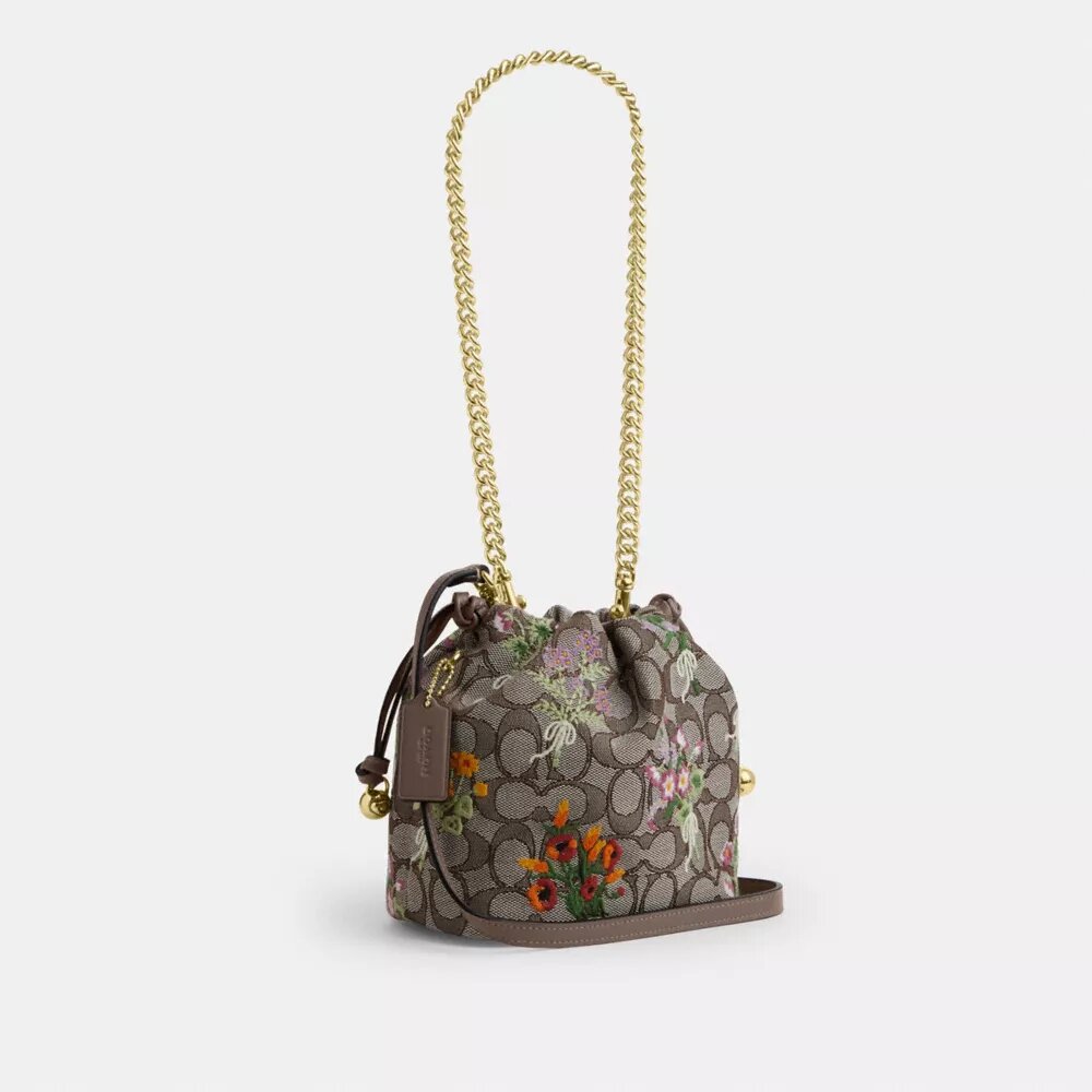 Faye Miniveske i signaturjacquard med blomsterbroderi