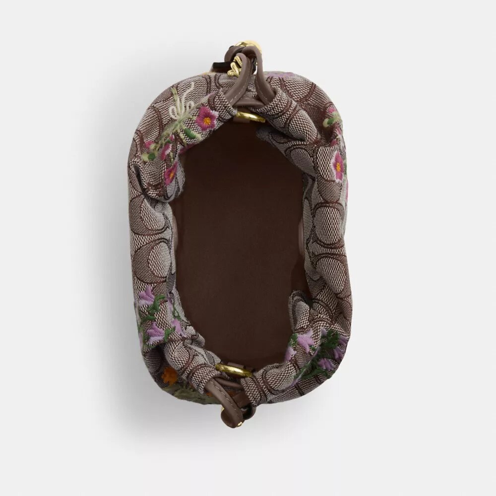 Faye Miniveske i signaturjacquard med blomsterbroderi