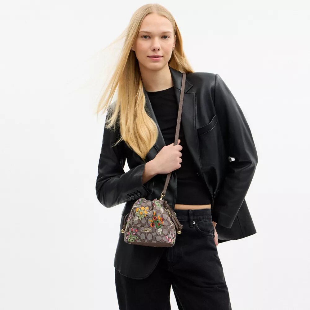 Faye Miniveske i signaturjacquard med blomsterbroderi