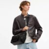 Finn-crossbody-veske med lommer