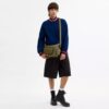 Finn-crossbody-veske med lommer