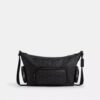 Finn-crossbody-veske med lommer i Signature Canvas