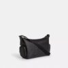 Finn-crossbody-veske med lommer i Signature Canvas