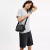 Graham-crossbody-veske i Signature Canvas med striper