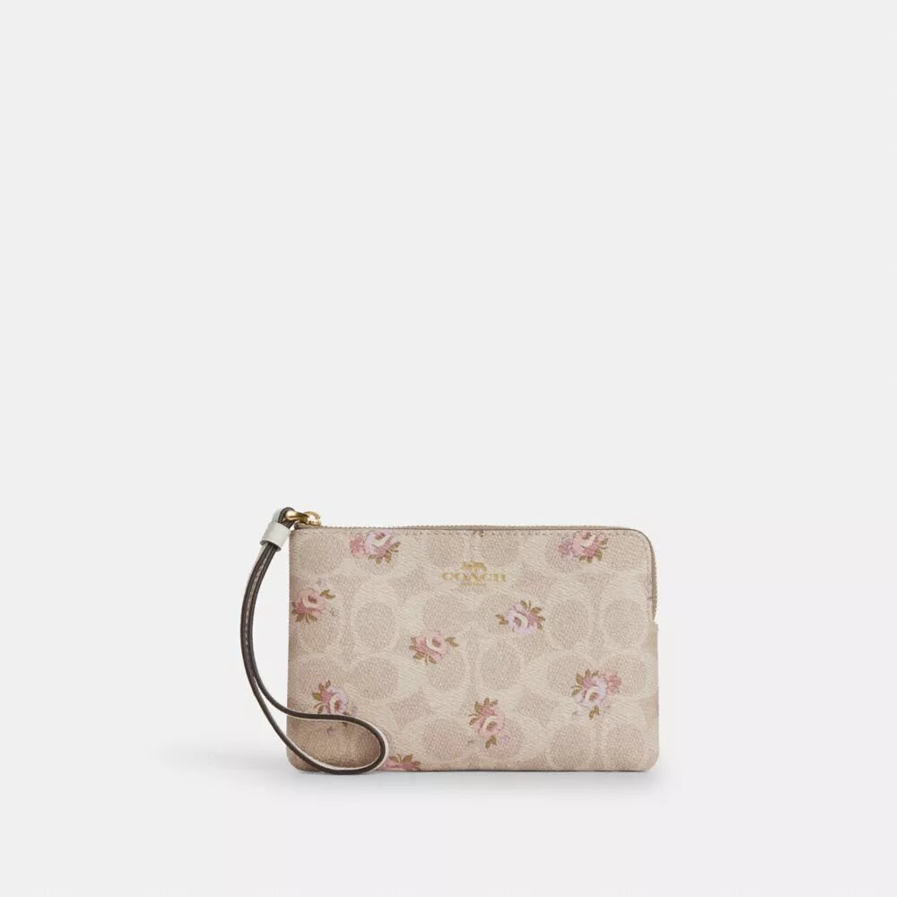 Håndleddsveske med glidelås i hjørnet i Signature Canvas med blomstertrykk