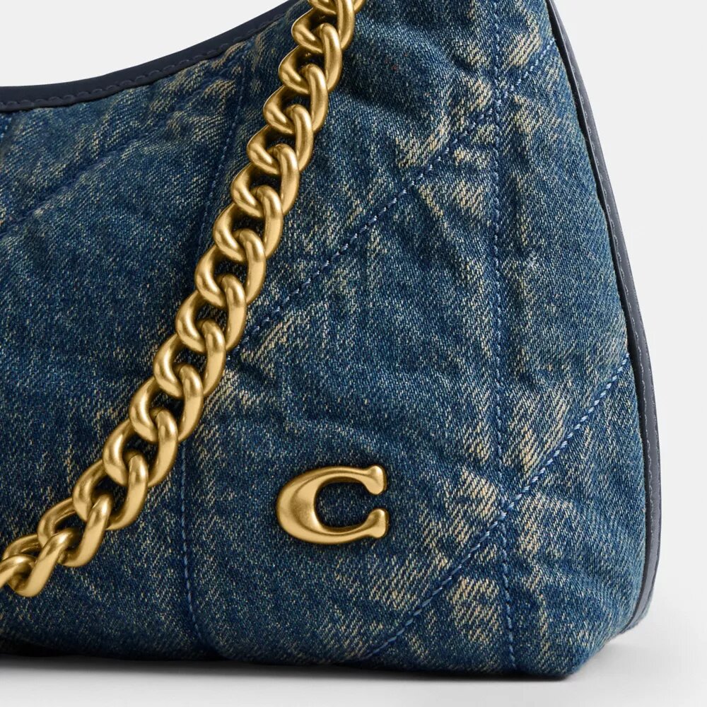 Juliet skulderveske 25 i regenerativ bomullsdenim med vattering