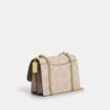Klare crossbody-veske i blokkmønstret Signature Canvas