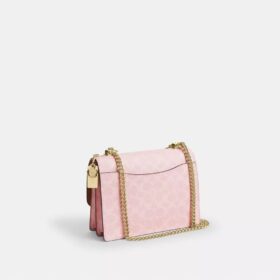 Klare-crossbody-veske i Signature Canvas med anheng