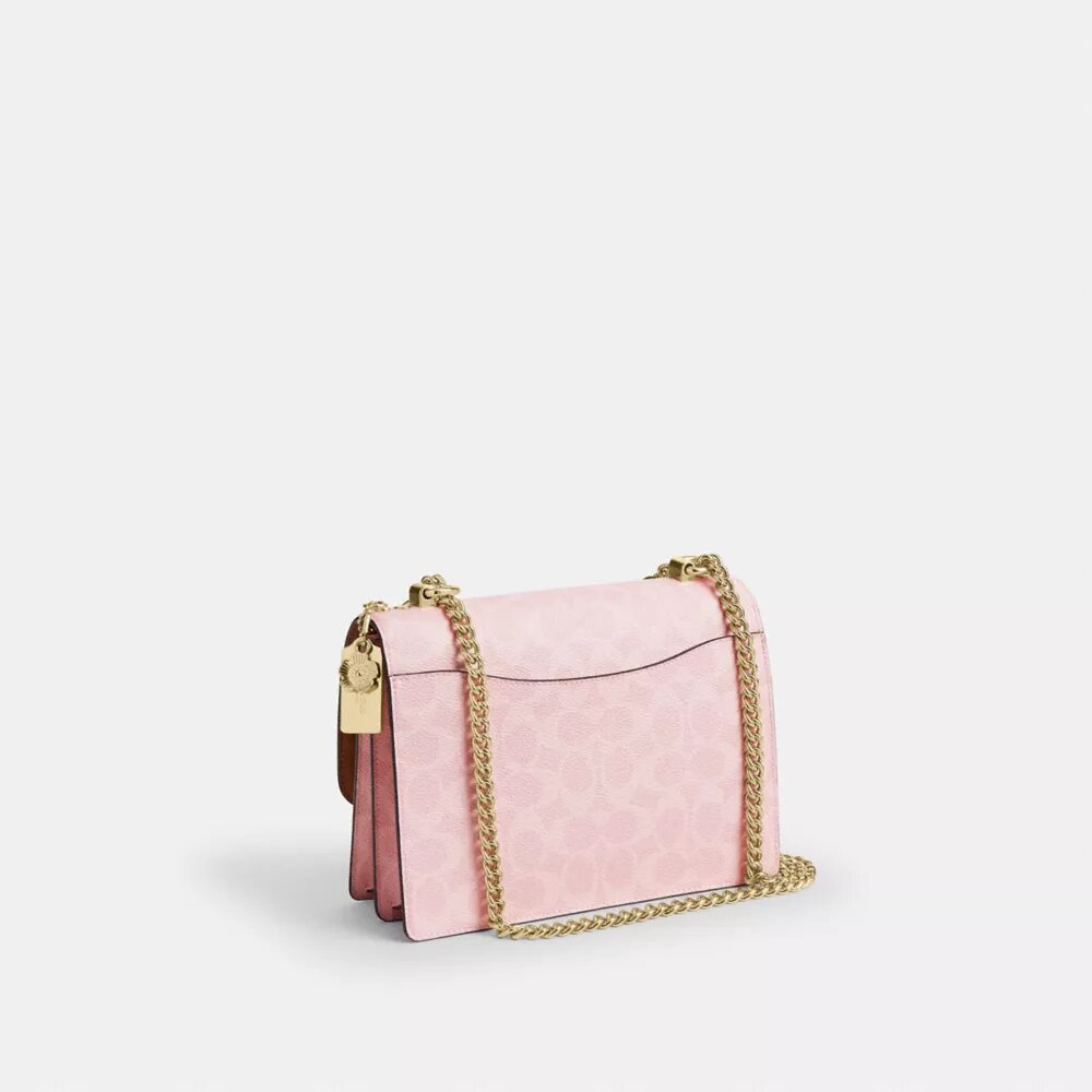 Klare-crossbody-veske i Signature Canvas med anheng