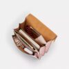 Klare-crossbody-veske i Signature Canvas med anheng