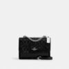 Klare-crossbody-veske i signaturlær