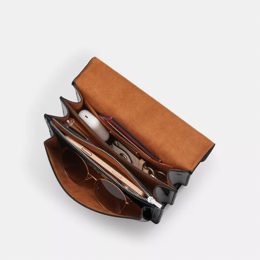 Klare-crossbody-veske i signaturlær