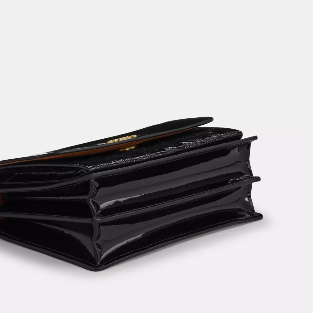 Klare-crossbody-veske i signaturlær