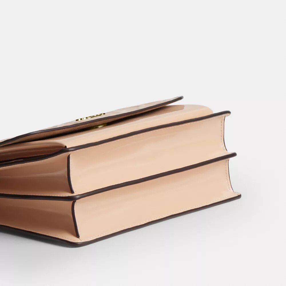 Klare-crossbody-veske i signaturlær