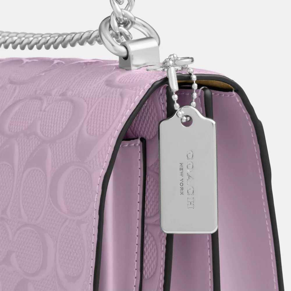 Klare-crossbody-veske i signaturlær