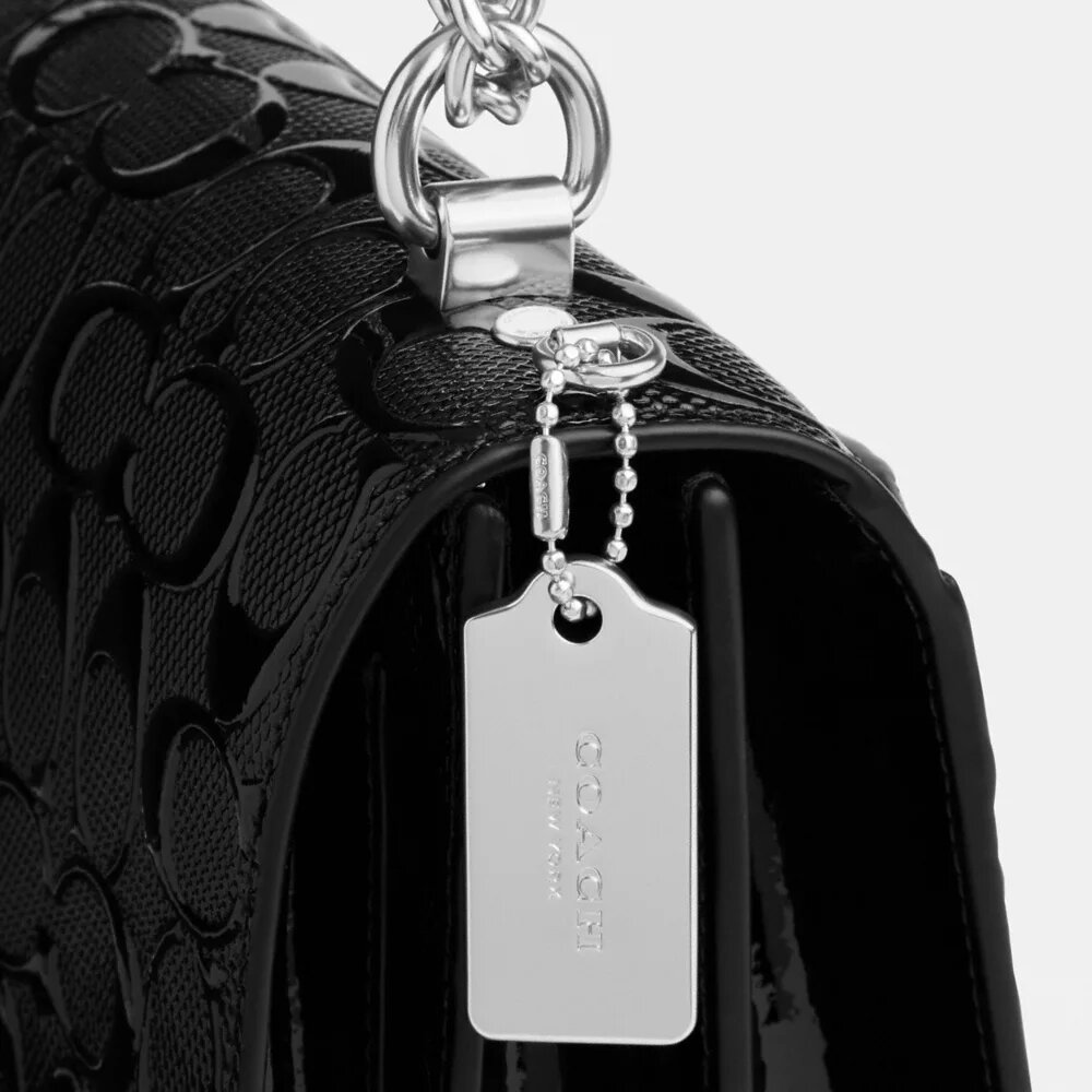 Klare-crossbody-veske i signaturlær