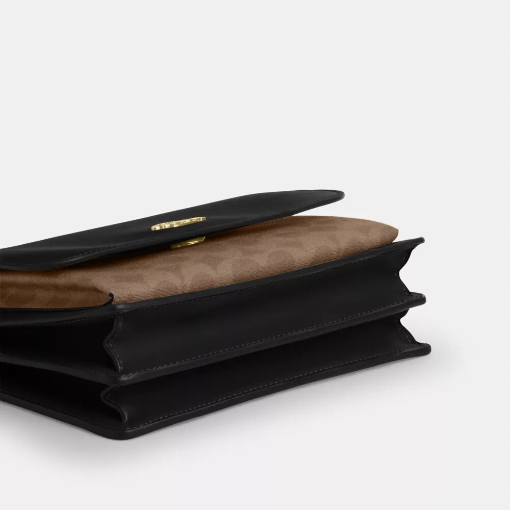 Klare-veske med kryssrem i Signature Canvas