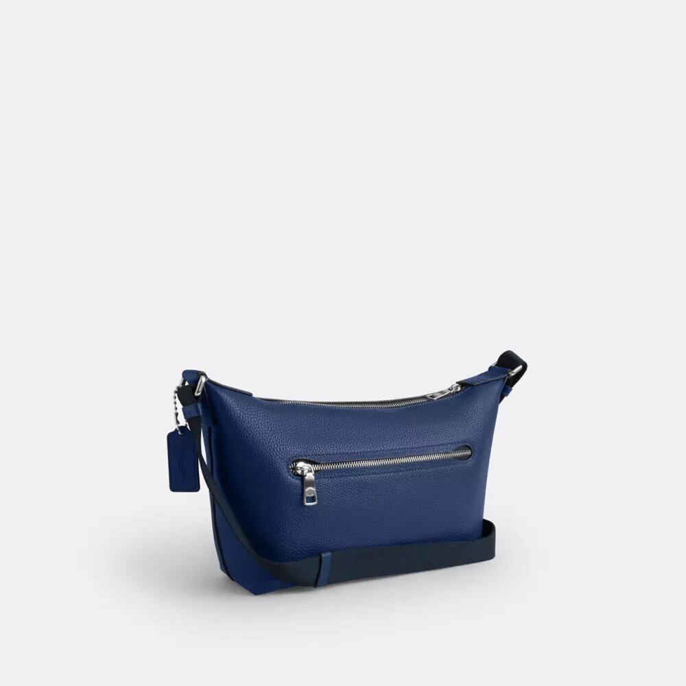 Liten Finn-crossbody-veske med kryssrem og lomme